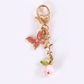 Portachiavi con farfalla rosa, mughetto e chiusura a cuore dorata per borsa - Farfalla Mughetto Rosa