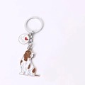 Portachiavi in metallo Basset Hound con ciondolo I Love Dogs su sfondo bianco - Cuore Cocker Girato (Basset Hound)