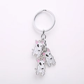 Detailed close-up of Bull Terrier dog charms with pink ears on a silver keychain - Bull Terrier Charm