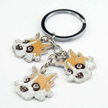 Detailed macro view of metal key ring featuring three colorful enamel bulldog charms - Boxer Mix