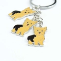 Detailed view of three Yorkshire Terrier enamel charms on a silver metal keychain - Yorkshire Terrier Charm
