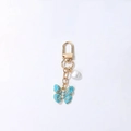 Light blue butterfly pendant with pearls and crystals on a gold keychain clasp - Blue Sparkling Rhinestone Pearl Butterfly
