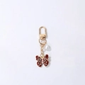 Sparkling dark red butterfly charm with pearls and crystals on a gold keychain - Burgundy Sparkling Rhinestone Pearl Butterfly