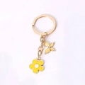 Golden butterfly and yellow flower keychain charm with rhinestones and enamel finish - Yellow Flower And Butterfly