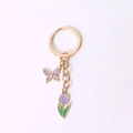 Golden butterfly and purple tulip charm keychain with a polished circular ring - Purple Tulip And Butterfly
