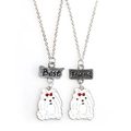 Close-up of Best Friend pet necklaces with dog charms and engraved silver plates - Maltese