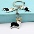 Λεπτομέρεια από τρία μενταγιόν σκύλου Corgi σε μεταλλικό μπρελόκ με φινίρισμα σμάλτου - Τριπλό Μαύρο Κόργκι