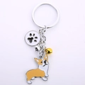 Portachiavi in metallo cane Corgi con ciondolo in smalto colorato e campanellino d'oro - Corgi (Corgi Zampa)