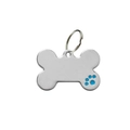 Close-up of bone-shaped stainless steel pet ID tag with blue paw print and split ring - Blue