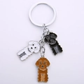 Cartoon metal poodle keychain with three colorful enamel teddy dog pendants on a metal ring - Poodle Mix (Black White Brown) / 10cm