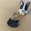 Cat head shaped black enamel pet ID tag with El Gato Gordo text and silver metal edges - 23*28mm / Black