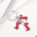 Portachiavi creativo con tre dinosauri in smalto rosso su un anello in metallo argento - Ciondolo Triplo Dinosauro Rosso