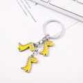 Portachiavi creativo a forma di dinosauro giallo con tre ciondoli e anello in metallo argento - Ciondolo Triplo Dinosauro Giallo