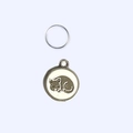 Macro shot of a zinc alloy round pet tag with a black line-drawn sleeping cat design - 2.5cm / White Cat