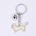 Porte-clés chien teckel en métal émaillé beige avec petit pendentif empreinte - Vieux Teckel avec Patte Blanche
