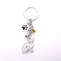 Sphinx cat keychain with white enamel charm, gold bell, and paw print pendant - White Sphinx Cat