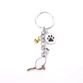 Brown and white cat keychain with silver metal rings and colorful mini bell charms - White Calico Cat