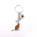 Cute brown and white cat enamel keychain with paw charm and colorful metal bells - Brown Calico Cat