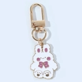 Detail showing cute white rabbit pendant with pink enamel bow and golden metal keychain hook - Purple Bow Rabbit with Clasp