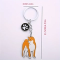 Cute shiba inu metal keychain with orange dog pendant and small black paw charm - Akita + Paw