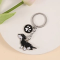 Creative dachshund heart keychain with paw charm in black and white enamel finish - Black Dachshund with Paw