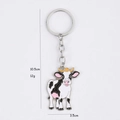 Porte-clés vache dessin animé mignon avec dimensions 10,5cm x 3,5cm et anneau argenté - Vache