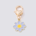 Golden keychain featuring a lavender enamel daisy flower pendant and heart-engraved clasp - Purple Floral