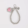 Detail of silver beaded keychain with rhinestone heart frame and engraved metal tag - Apple