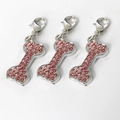 Set di tre ciondoli a forma di osso in argento con strass rosa e chiusura a moschettone - Rosa