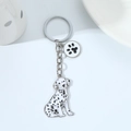 Creative black and white spotted dog keychain with a circular paw print charm - Dalmatian Style (Spots + Paws)