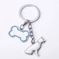Detailed close-up of a bone-shaped charm and German Shepherd pendant with rhinestones - German Shepherd Bone / 10cm
