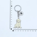 Golden Retriever Emaille-Schlüsselanhänger in Cremeweiß mit schwarzem Pfotenabdruck - Golden Retriever mit Pfote