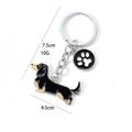 Dachshund-Schlüsselanhänger aus Zinklegierung mit schwarzem Pfotenabdruck-Anhänger - Schwarzer Dackel mit Pfote