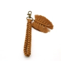 Close-up of handmade yellow woven keychain with leaf charm and bronze lobster clasp - 2*18cm / Orange