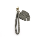 Detail of grey macrame keychain with woven cotton feather charm and bronze clasp - 2*18cm / Gray