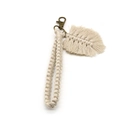 Detailed macro view of handmade cream cotton woven keychain with leaf tassel and bronze clasp - 2*18cm / Beige