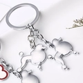 Porte-clés chien en argent poli avec deux breloques caniche et un petit cœur rouge - Caniche / 10cm