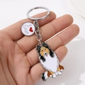 Zinc alloy Sheltie dog keychain with I Love Dogs metal charm held in hand - Sheltie with Long Hair and Heart