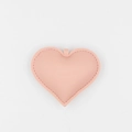 Pink heart-shaped PU leather keychain accessory with precise stitching on white background - Pink