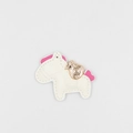 Detailed close-up of a white leather pony keychain with gold lucky bag and pink accents - White