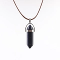Blue goldstone hexagonal prism pendant necklace with brown braided cord on white background - Blue Sandstone