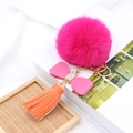 Faux fox fur pompom keychain with pink leather bow, rhinestones and orange tassel detail - Pink Bow Orange Tassel