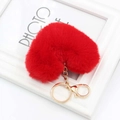Detailed close-up of vibrant red plush heart keychain with gold-tone hardware links - Red