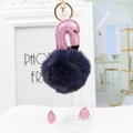 Detail of pink flamingo keychain with dark blue faux fur pompom and golden lobster clasp - 18*8cm / Navy Blue