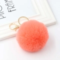 Detail of coral orange plush faux rabbit fur pom pom keychain with gold lobster clasp and ring - Orange Red