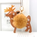 Detail of faux fur pompom deer keychain with snowflake leather and gold glitter antlers - Coffee