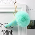 Mint green plush faux fur ice cream keychain with gold hardware on white frame background - Mint Green