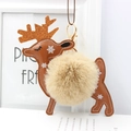 Detail of faux rabbit fur reindeer keychain with golden sequin antlers and white snowflakes - Khaki
