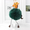 Detailed close-up of a green giraffe plush pom-pom keychain with stylish faux fur texture - Army Green
