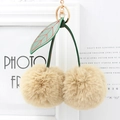 Portachiavi a ciliegia in peluche kaki con morbide palline di pelo e foglia verde chic - Cachi